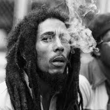 Musician Bob Marley breathing out smoke